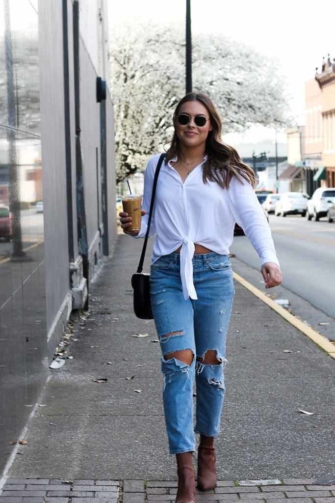 White shirt and store tattered jeans